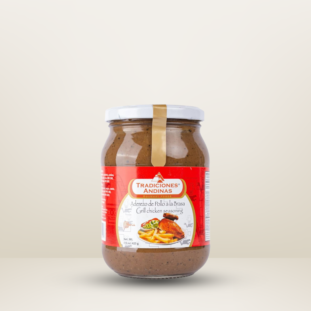 Frasco de Tradiciones Andinas Aderezo Pollo, aderezo con especias peruanas para marinar y dar sabor al pollo, disponible para envío en Vancouver y Canadá."