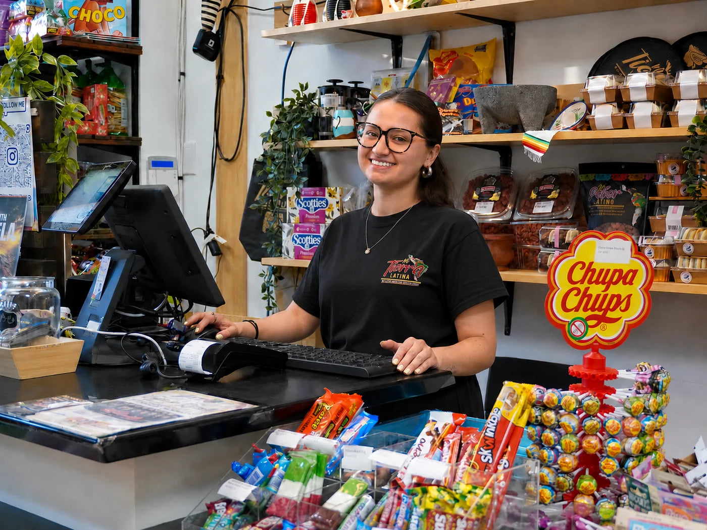 Mi Tierra Latina team member helping customers at the counter
