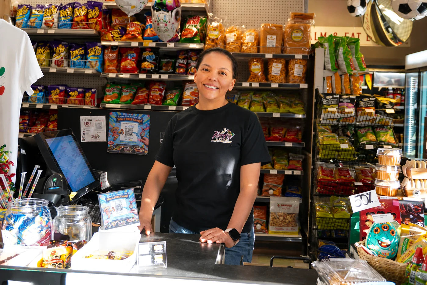 Mi Tierra Latina staff member ready to help at the register