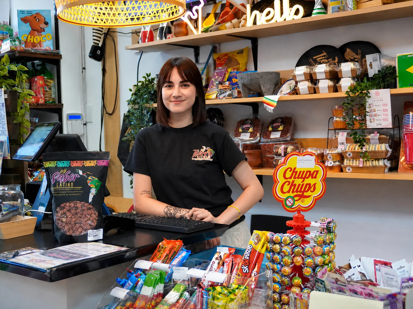 Mi Tierra Latina team member at the checkout counter